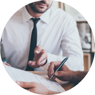 Person signing contract and wearing tie