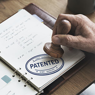 Notebook open to the word Patent